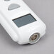 A white Taylor digital infrared thermometer with buttons.