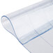 A close-up of a clear plastic strip with a curved edge.