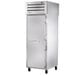 A large silver True Spec Series pass-through refrigerator with a white door and a handle.