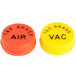 A pair of yellow and orange plastic caps with black text reading "Brass" and "Brass"