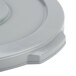 A gray plastic lid for a Continental Huskee round trash can.