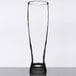 A clear Libbey pilsner glass on a table.