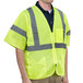 A man wearing a Cordova lime high visibility safety vest.