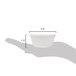A hand holding a small white fluted ramekin with a shadow.