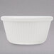 A white fluted Thunder Group ramekin on a gray background.