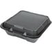 A black Genpak foam takeout container with a hinged lid.