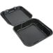 A black foam tray with a black hinged lid containing a Genpak SN200-BK foam container.