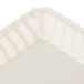 A white rectangular tray with a scalloped edge.