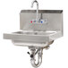 A stainless steel Advance Tabco hand sink with a splash mount faucet and lever operated drain.