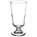 A clear Libbey footed highball glass with a small base.