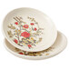 A white GET sauce dish with a floral design.