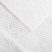 A close up of a white Chicopee DuraWipe fabric with a pattern.