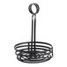 An American Metalcraft black wrought iron wire basket with a coil handle on a counter.
