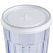 A clear plastic Cambro lid with a straw slot over a clear plastic tumbler.