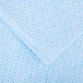 A close up of a blue fabric with a white background.