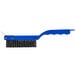 A blue Carlisle Sparta grill brush with a plastic handle and black bristles.