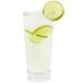 A Libbey stackable cooler glass filled with limeade and a lime wedge.