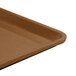 A close-up of a brown Cambro dietary tray.