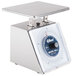 An Edlund stainless steel portion scale with a white dial on a counter.