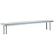 A long rectangular stainless steel shelf with legs on a table.