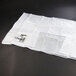 A white plastic bag with black text that reads "Metro DSDV11 Heavy-Duty 6-Mil Double Side Load Dish and Tray Cart Vinyl Cover"