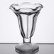 A clear Libbey tulip sundae glass with a swirly bottom and curved edge.