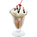 A Libbey tulip sundae glass filled with chocolate ice cream and whipped cream.