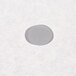 A close-up of a grey circle on white paper.