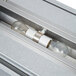 An APW Wyott lighted strip warmer with two light bulbs inside a silver metal box.