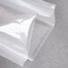 An ARY VacMaster chamber vacuum packaging pouch on a clear plastic wrap.
