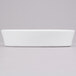 A white rectangular Hall China baker dish on a gray surface.