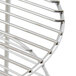 A close up of a stainless steel Nemco three tier rack system.