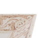 A close up of a white and brown square melamine plate with a design.