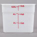 A white square Cambro food storage container with red measurements.