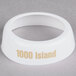 A white plastic Tablecraft salad dressing dispenser collar with beige lettering that says "1000 Island"