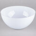 A white Fineline Platter Pleasers plastic bowl on a gray background.