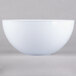A close-up of a Fineline white plastic round bowl.
