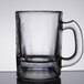 An Anchor Hocking clear glass beer tasting mug with a handle.