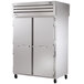 A stainless steel True pass-through heated holding cabinet with two solid doors.