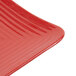 A red GET Red Sensation square melamine plate with a thin wavy design.