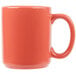 A close up of a Tuxton Cinnebar mug with a red handle.