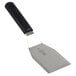 A Mercer Culinary Millennia heavy duty turner with a black handle and silver blade.
