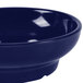 A close-up of a GET cobalt blue salsa bowl with a white interior.