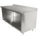 A stainless steel Advance Tabco work table with a cabinet base and shelf.