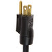 A black power cord with a gold plug attached to an APW Wyott RTR-4Di Drop-In Cold Well.