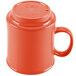 A close-up of a red GET Diamond Mardi Gras Rio Orange Mug with a lid.
