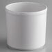 A white round melamine condiment jar on a gray surface.