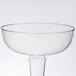 A Fineline clear plastic champagne glass with a stem.