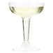 A Fineline Flairware clear plastic champagne glass filled with a clear liquid.