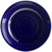 A cobalt blue Tuxton Concentrix china plate with a spiral pattern.